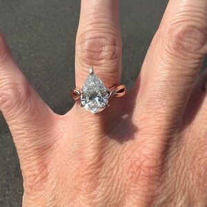 Rose gold pear shaped diamond engagement ring, 3.1 carats, perfect clarity.